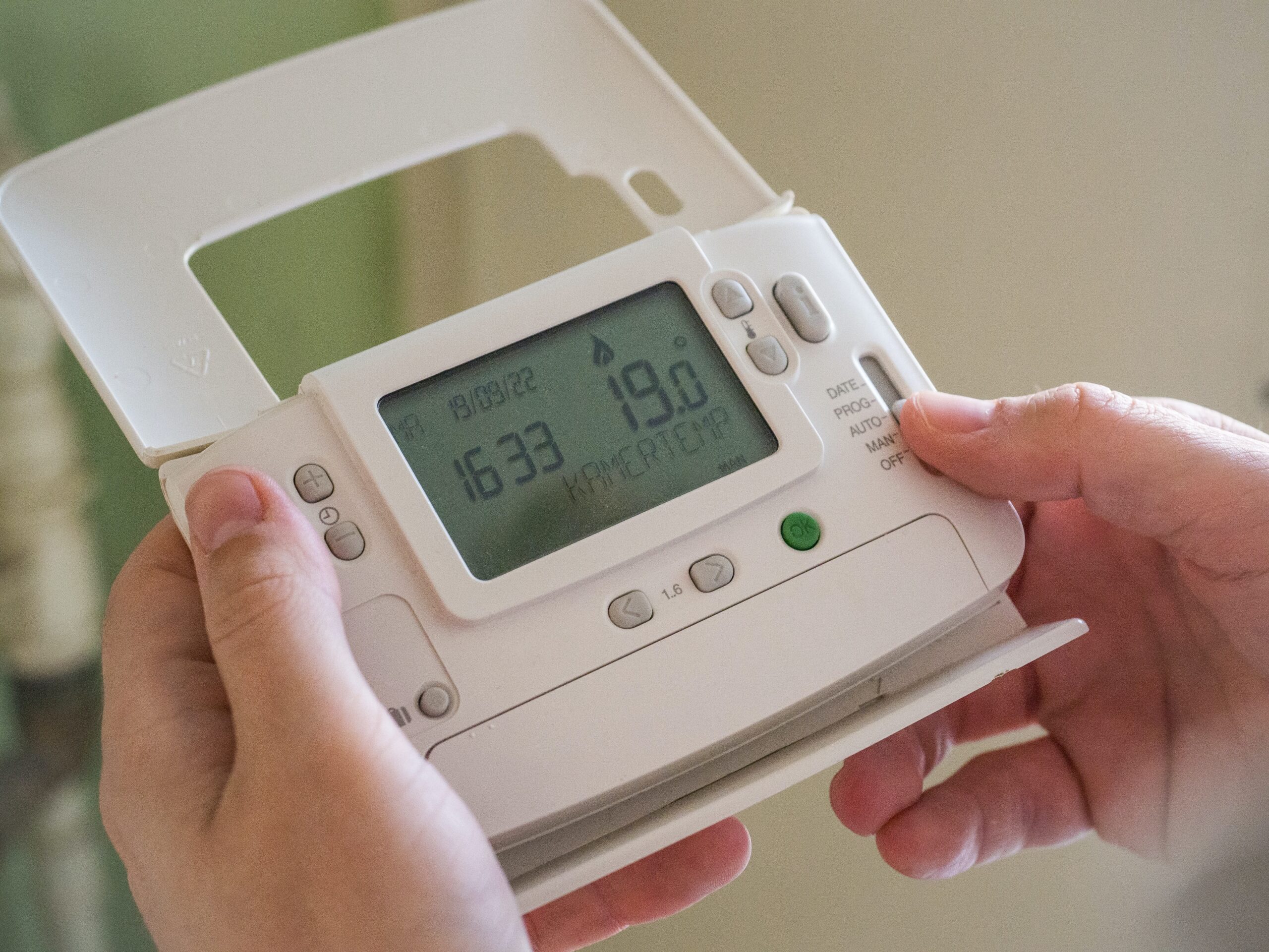 thermostat in hand